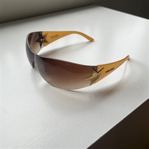 prada wrap around star sunglasses